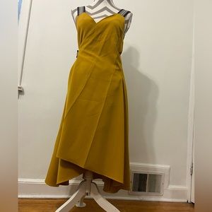 Never used, mustard color with blue straps